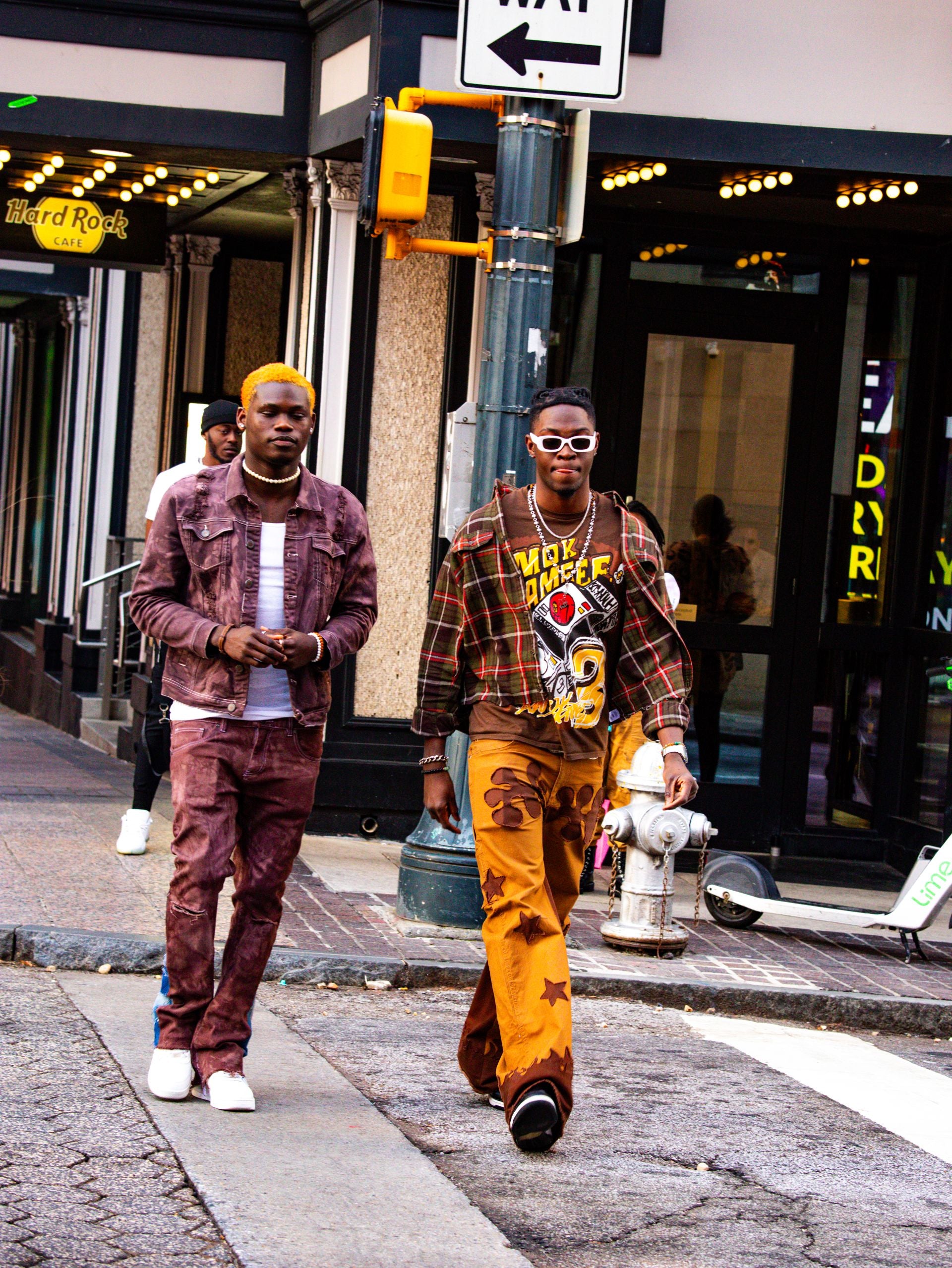 Two fashion models walking in the street